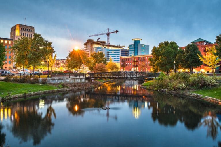 A beautiful view of downtown kalamazoo by the river, one of the best places to stay in michigan