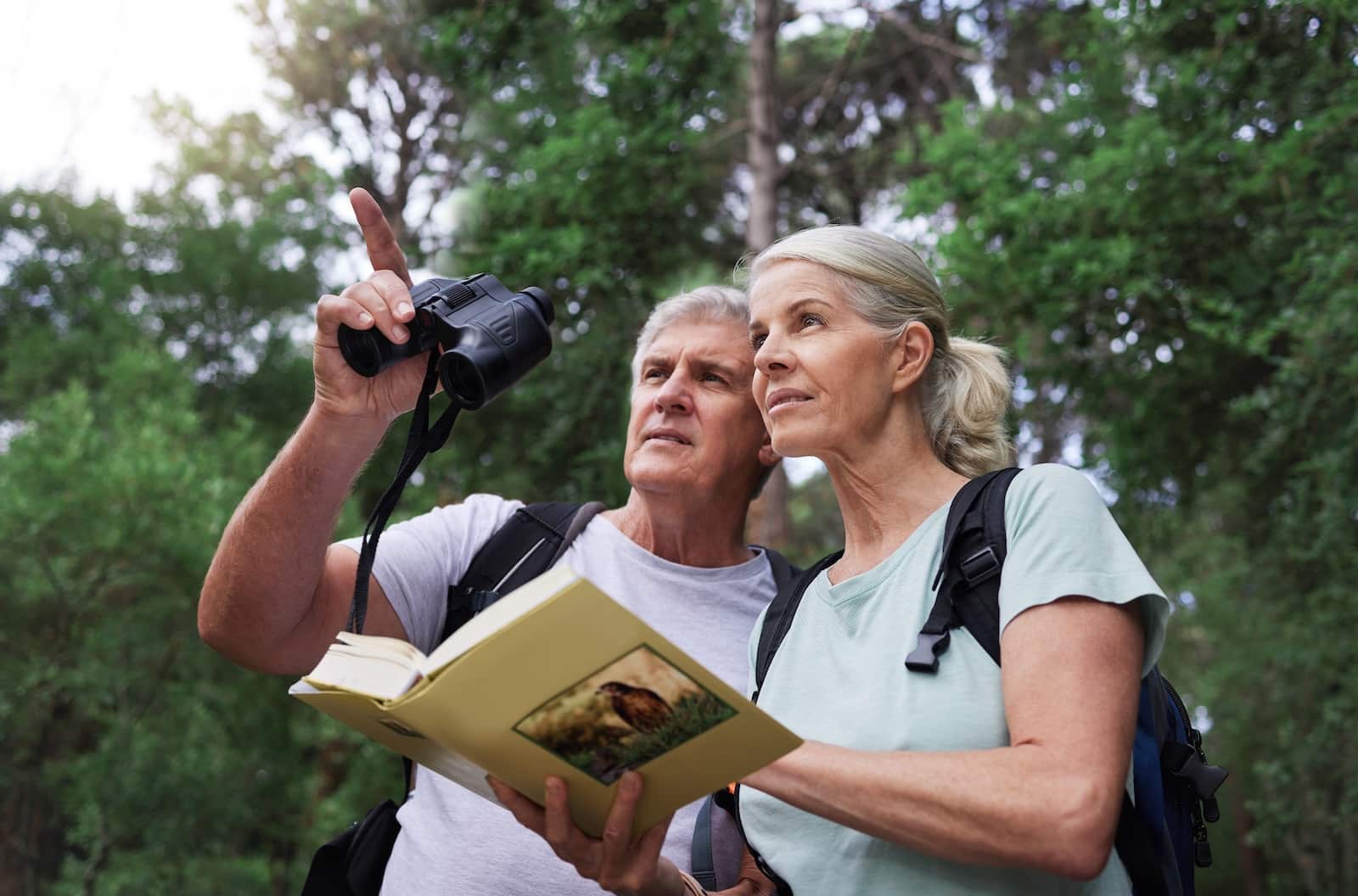 And older couple enjoying one of the parks in kalamazoo for birdwatching