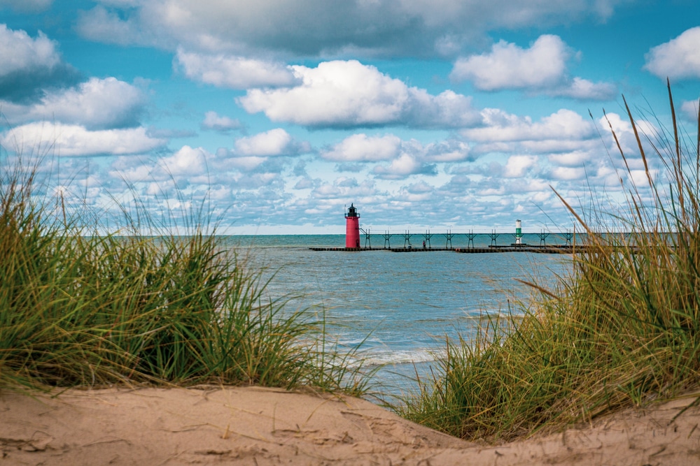 Spending time at the beach overlooking the lighthouse is one of the top things to do in south haven, mi