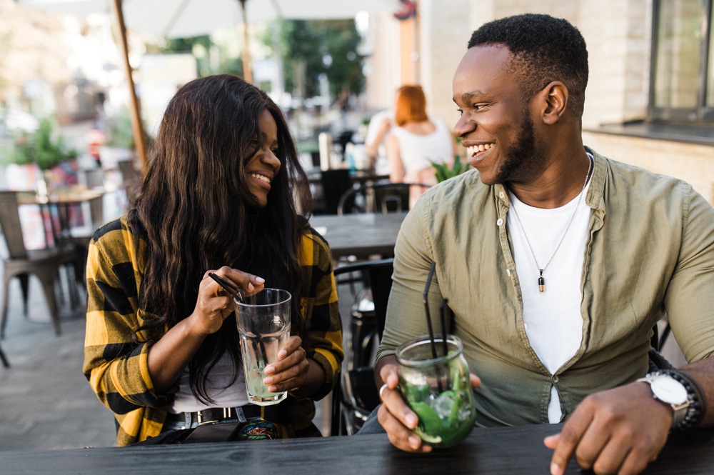 A couple eating and drinking in downtown kalamazoo