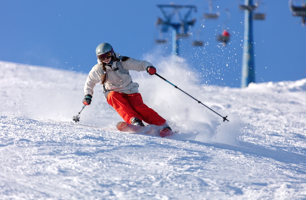 a downhill skier at Timber Ridge Ski Area, a hidden gem among ski resorts in michigan