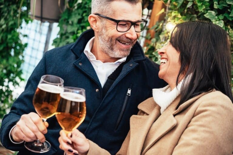 A couple enjoying drinks during their romantic getaways in michigan