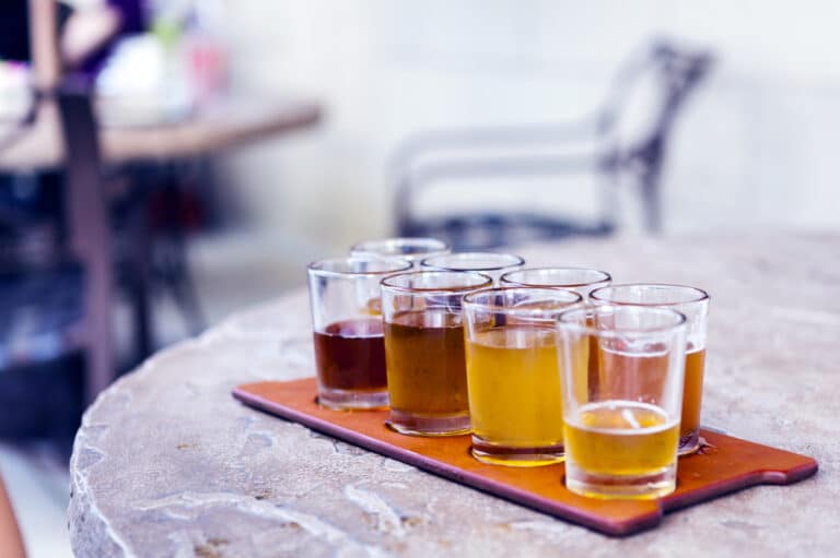 A flight of beer in michigan, like those you'll find at the best breweries in kalamazoo
